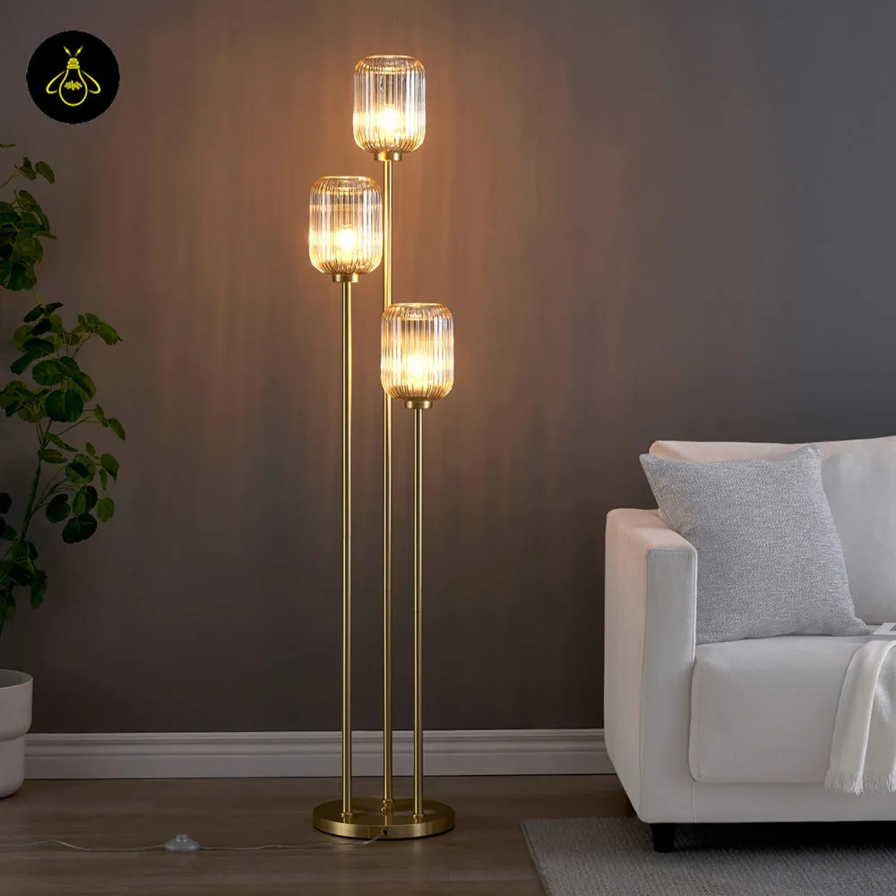 Triple Amber Glass Floor Lamp – 3-Light Gold Ribbed Glass Statement 4 Close-up of a ribbed amber glass shade on the triple amber glass floor lamp
