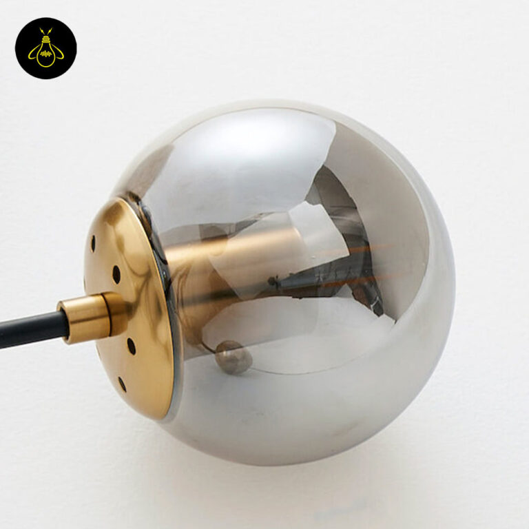 E27 bulb holder and smoke-grey glass globe of a black glass chandelier