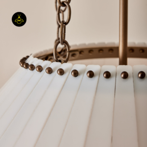 Milk-glass globes glowing warm on the antique brass chandelier