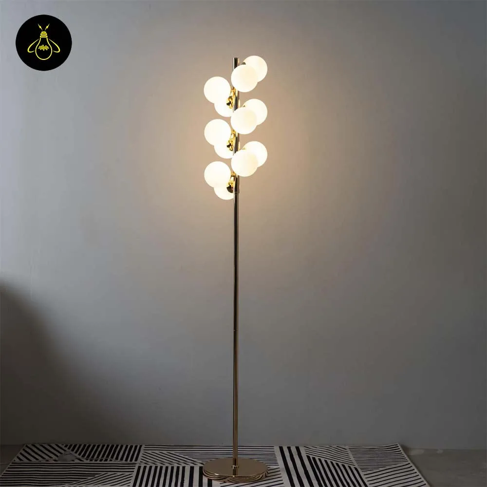 White Globe Floor Lamp – 12 Gold-Framed Opal Spheres | Ambrosia 4 Round polished gold disc base of the Ambrosia white globe floor lamp
