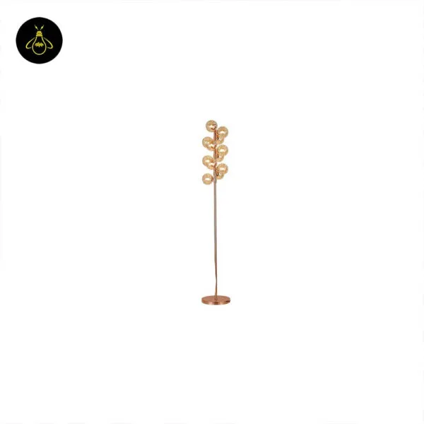 Polished gold base detail of floor lamp with amber borosilicate glass spheres