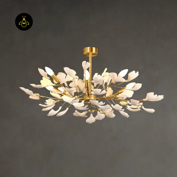 White ceramic ginkgo leaf chandelier with gold branches, angled view for a living room