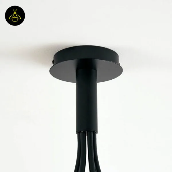 Close-up of smoked borosilicate glass ball shade on a black chandelier