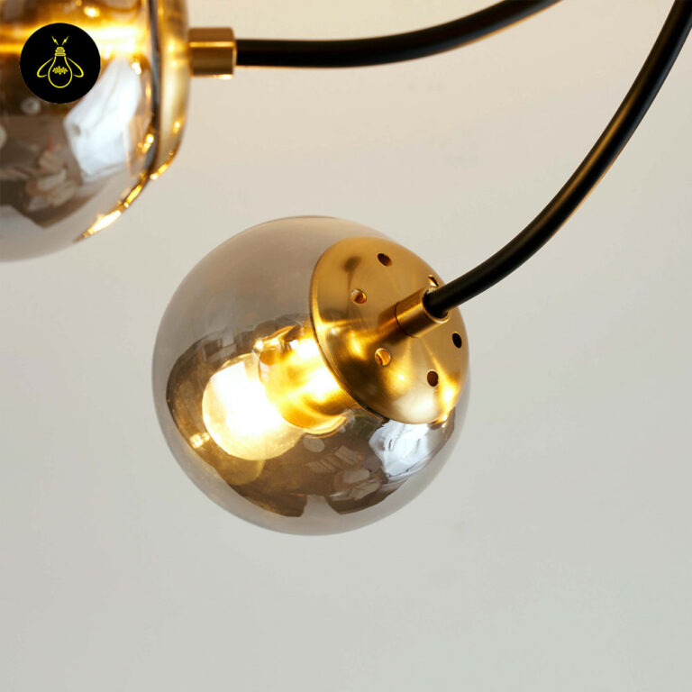 Six-globe black glass chandelier with smoke-grey balls and brass bulb cups