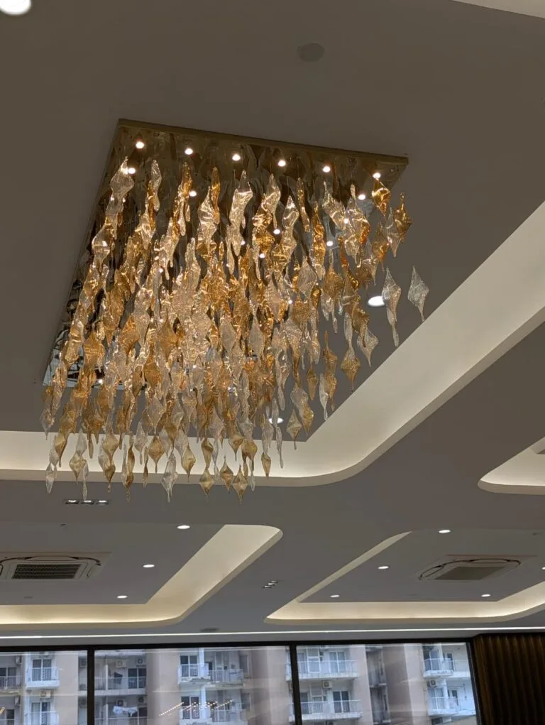 Close-up of twisted glass leaf detail on SKA Orion custom chandelier