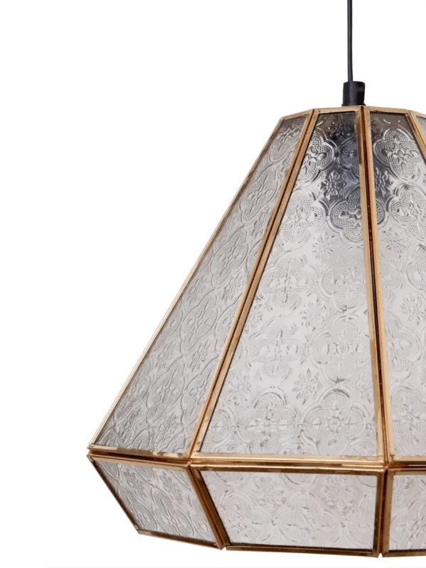 Close-up of the moroccan pendant light: pressed quatrefoil and flower pattern in clear borosilicate glass set in gold-finish stainless steel channels