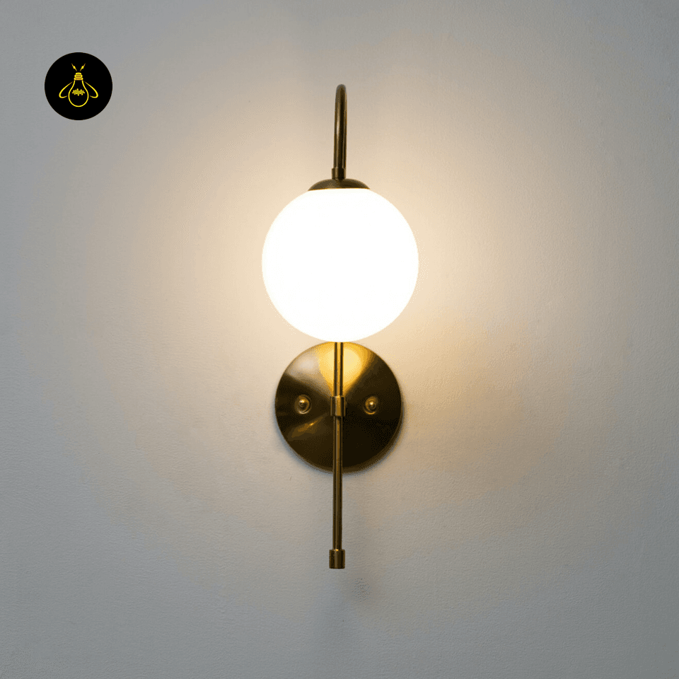 Gold Wall Light for Living Room – Oriol 48 cm Globe Sconce 6 Slim vintage-gold metal arm of the gold living room wall light holding a frosted glass globe
