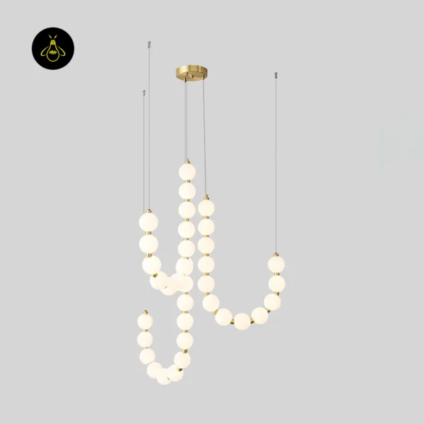 Gold orb pearl necklace chandelier strands hanging from a brass canopy