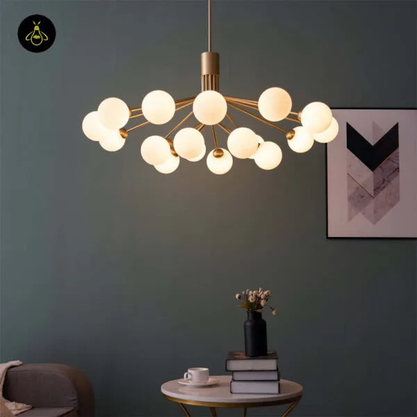 Gold-lustre borosilicate glass ball chandelier with white opal globes in a modern living space