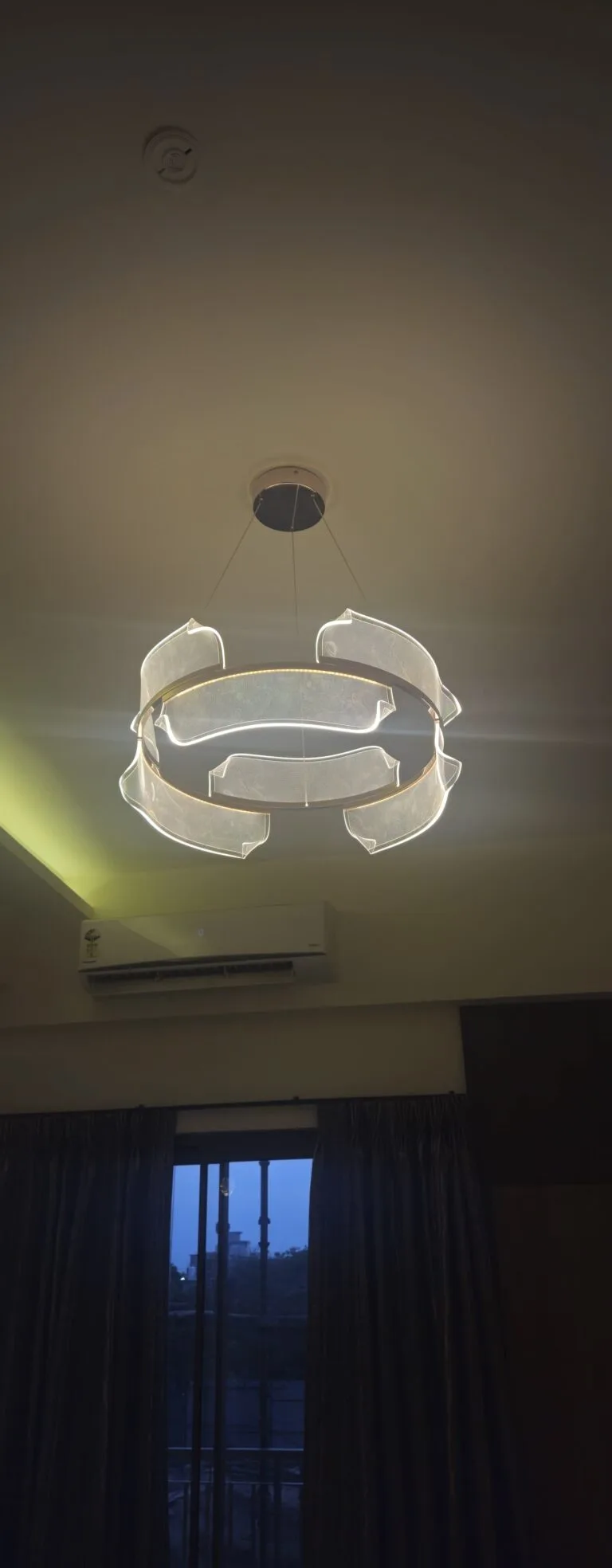 Disc chandelier with stone-look illuminated panels at SKA Destiny One