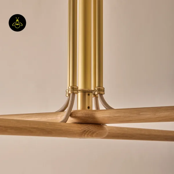 Handmade wood and brass chandelier with warm Edison bulbs