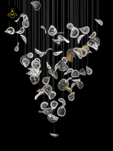 Cascade glass jhumar with frosted-edge glass leaves for a staircase and high ceiling