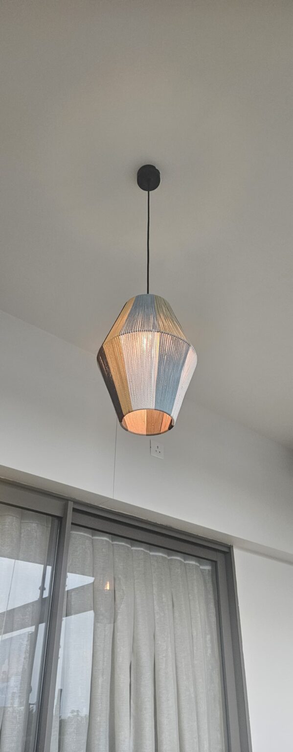 Industrial metal chandelier showing exposed structural metal character