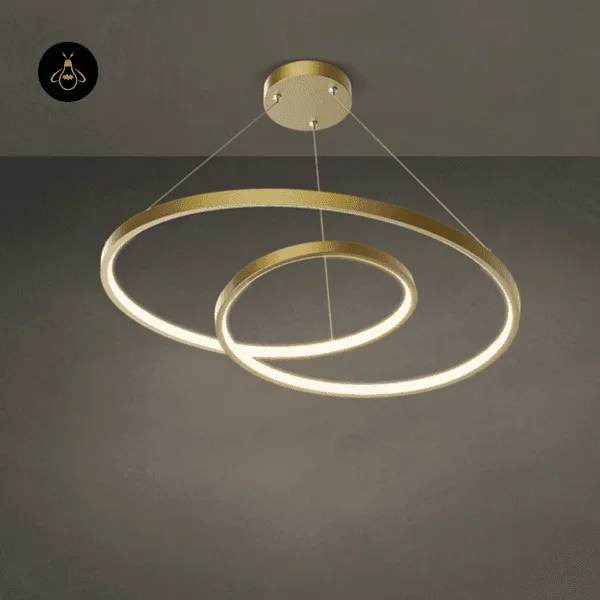 Spiral ring chandelier, gold-finish continuous LED ring, angled studio view