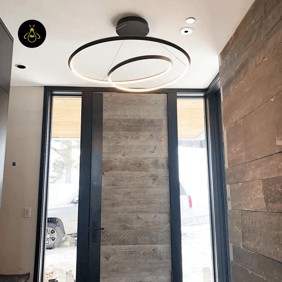Spiral Ring Chandelier – 62 cm Integrated LED, 3 Finishes | Jagmag Lights 4 Spiral ring chandelier over a dining table with a warm continuous LED glow