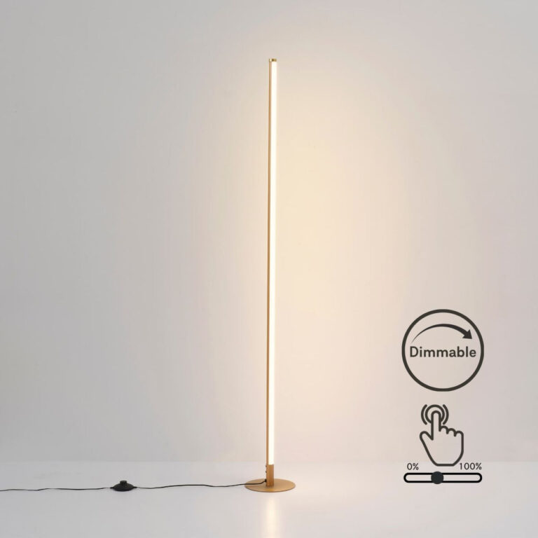 Gold LED floor lamp creating warm ambient light in a living room