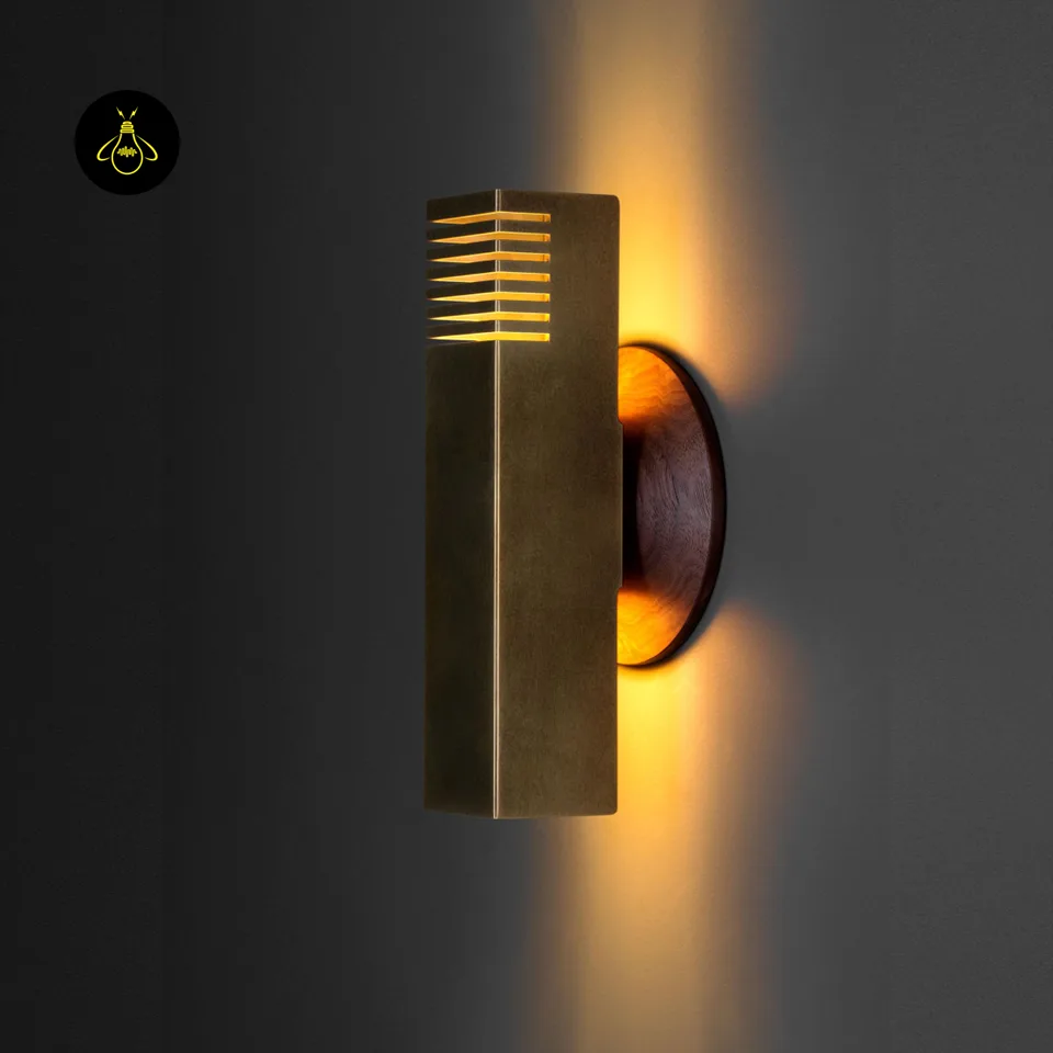 Boundary Wall Light – Brass-Finish Up & Down Sconce, 10.5 in 4 Brass boundary wall light on a round backplate, angled front view