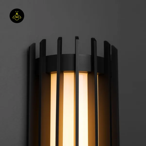 Close-up of the modern outdoor wall light crown: black stainless steel slats rising above the opal borosilicate glass cylinder