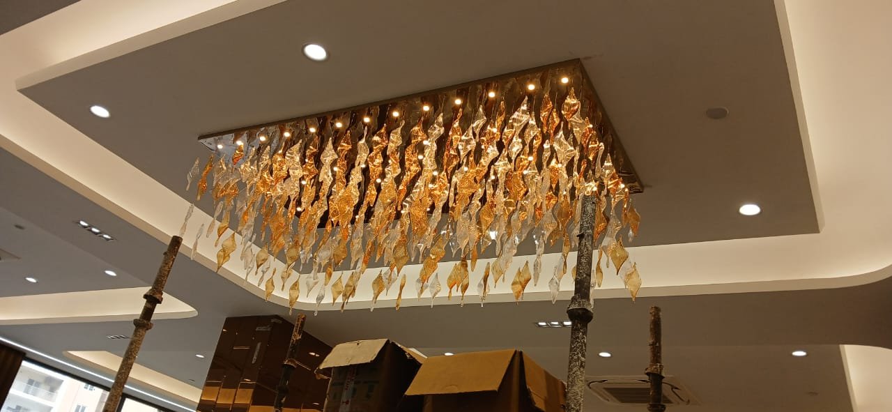 Custom twisted glass leaf chandelier project for SKA Orion in Noida