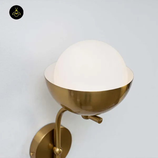 Opal white light close-up: opal borosilicate glass globe seated in the brass-finish 304 stainless steel cup