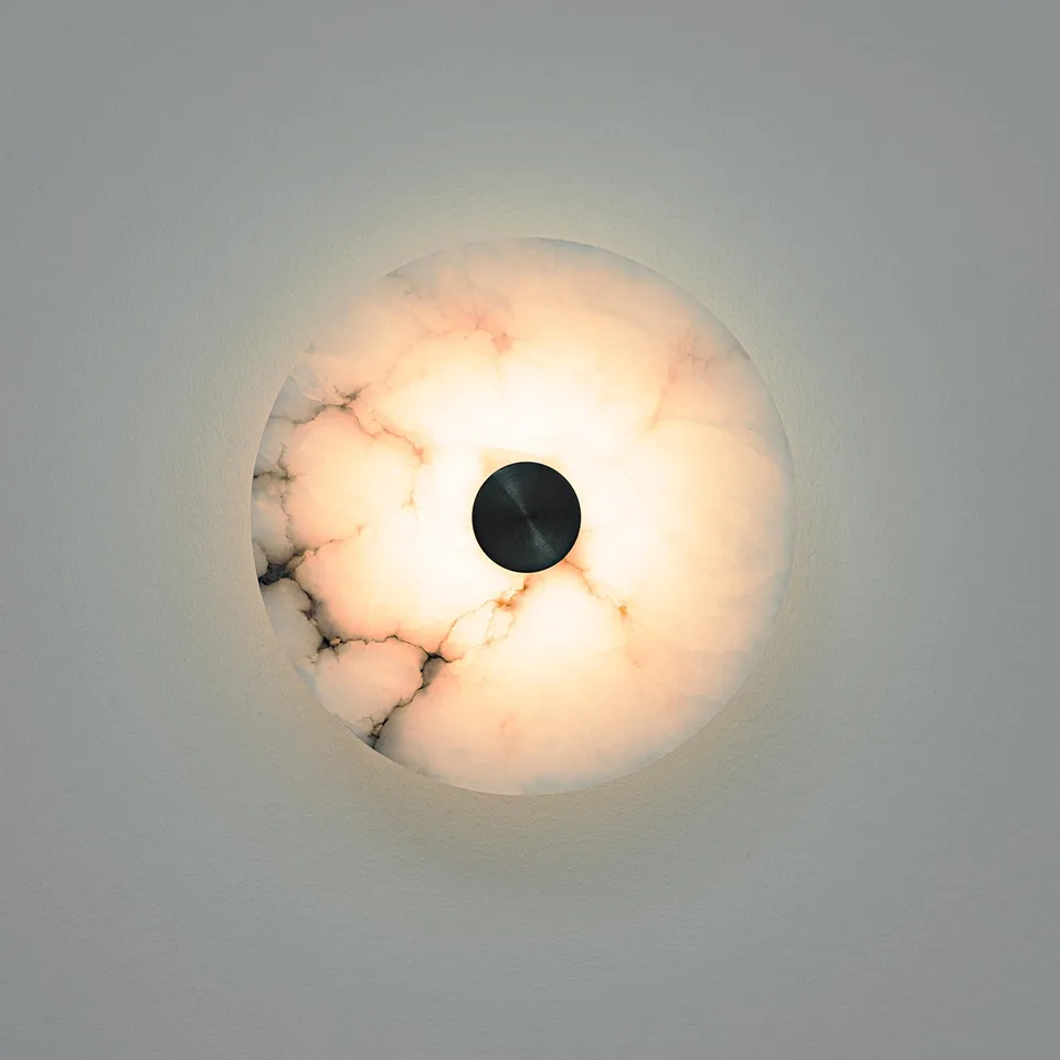 Alabaster Wall Light – Eclipse Disc Sconce, 4 Sizes | JagMag Lights 2 Alabaster wall light with a translucent round stone disc glowing warm around a black metal centre cap