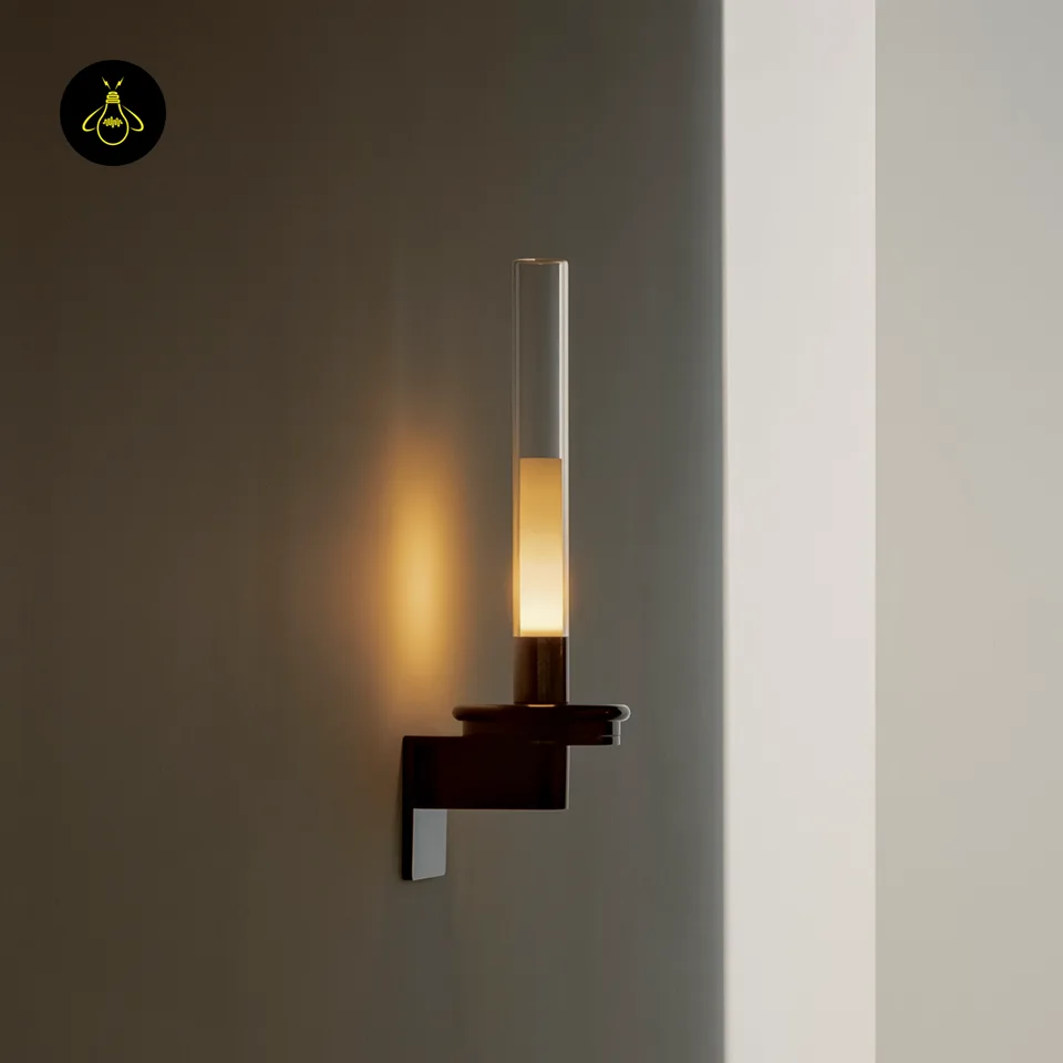 Black Glass Wall Light – Candle-Style Pyrex Glass Tube Sconce, Glossy Black, 46 cm 5 Black glass candle wall light glowing warm on a wall, close-up of glossy black metal base