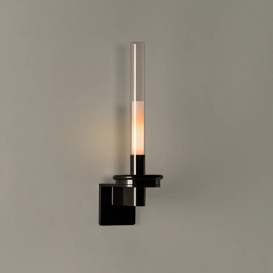 Black glass wall light with clear Pyrex candle tube on a glossy black base, front view