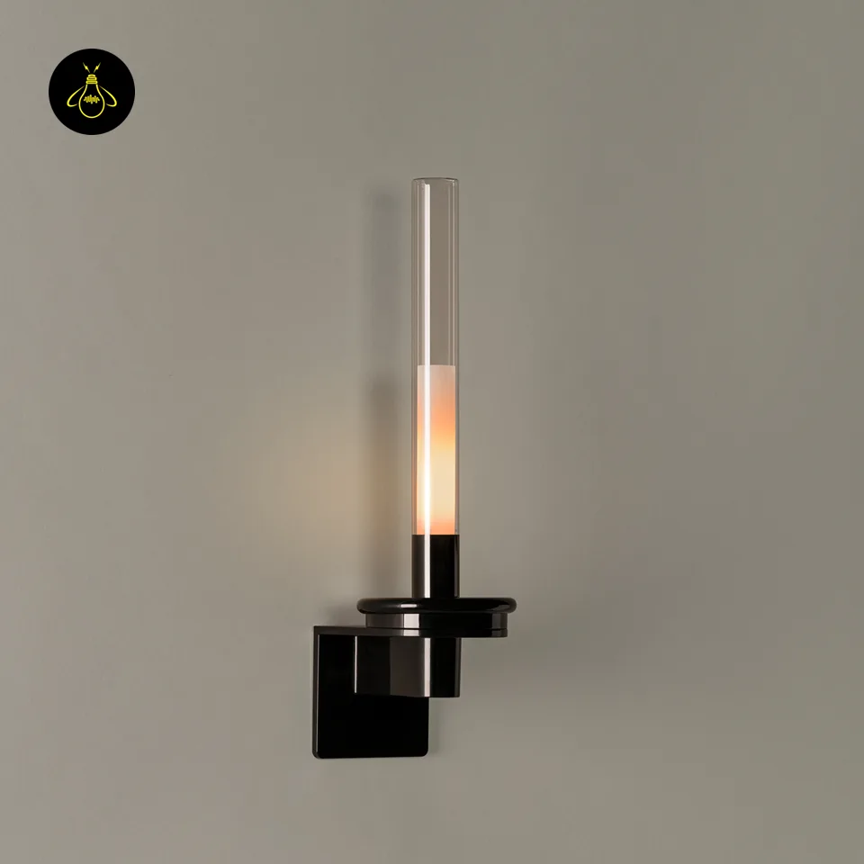 Black Glass Wall Light – Candle-Style Pyrex Glass Tube Sconce, Glossy Black, 46 cm 7 Lit black glass wall light showing warm candle glow through the clear Pyrex glass tube