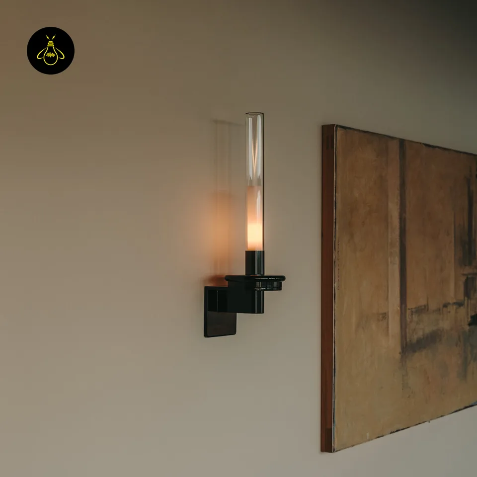 Black Glass Wall Light – Candle-Style Pyrex Glass Tube Sconce, Glossy Black, 46 cm 9 Black glass wall light used as accent lighting beside framed wall art