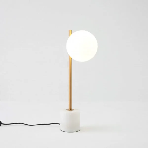Marble base table lamp with opal borosilicate glass globe and brass arm by Jagmag