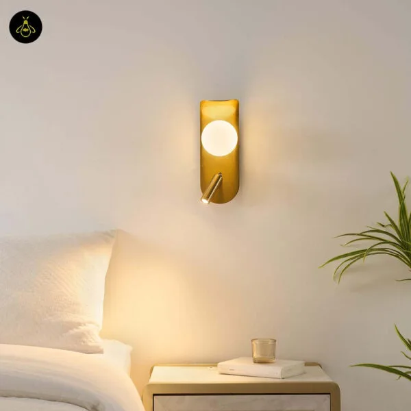 Bedroom reading light above a bedside table, opal borosilicate glass globe and angled reading spot lit at night