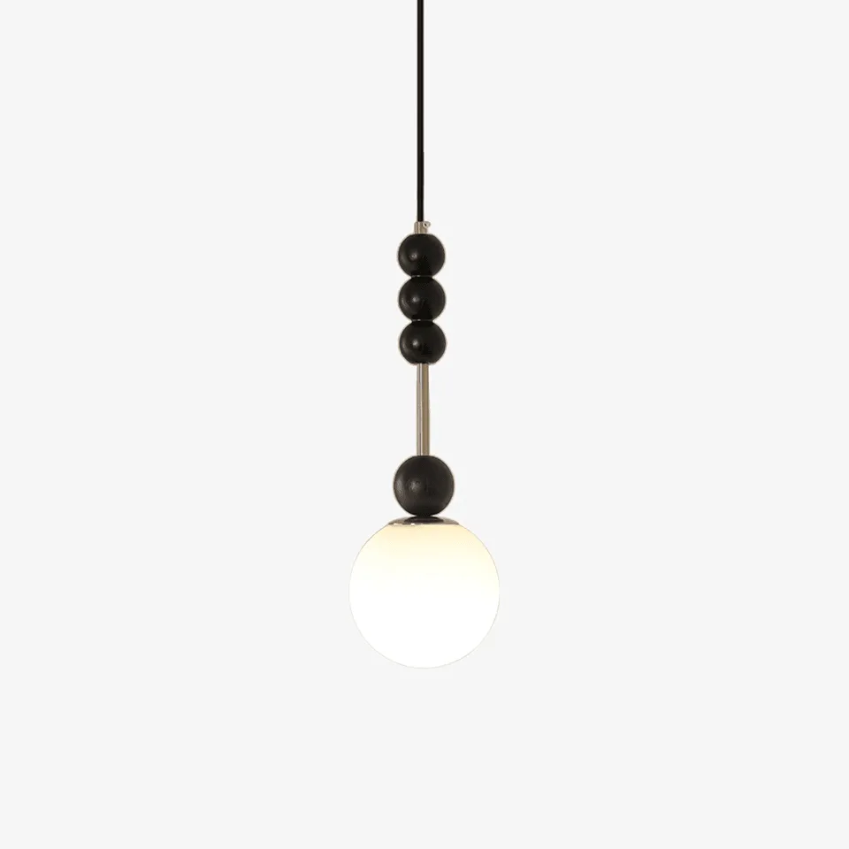 Glass globe pendant light with opal glass shade and chrome beaded stem for a bedside