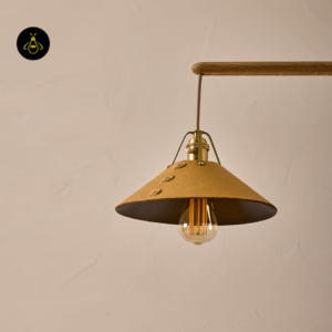 Close-up of a leather-clad brass cone shade on the wood and brass chandelier