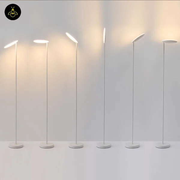 White LED floor lamp with adjustable head in a living room corner