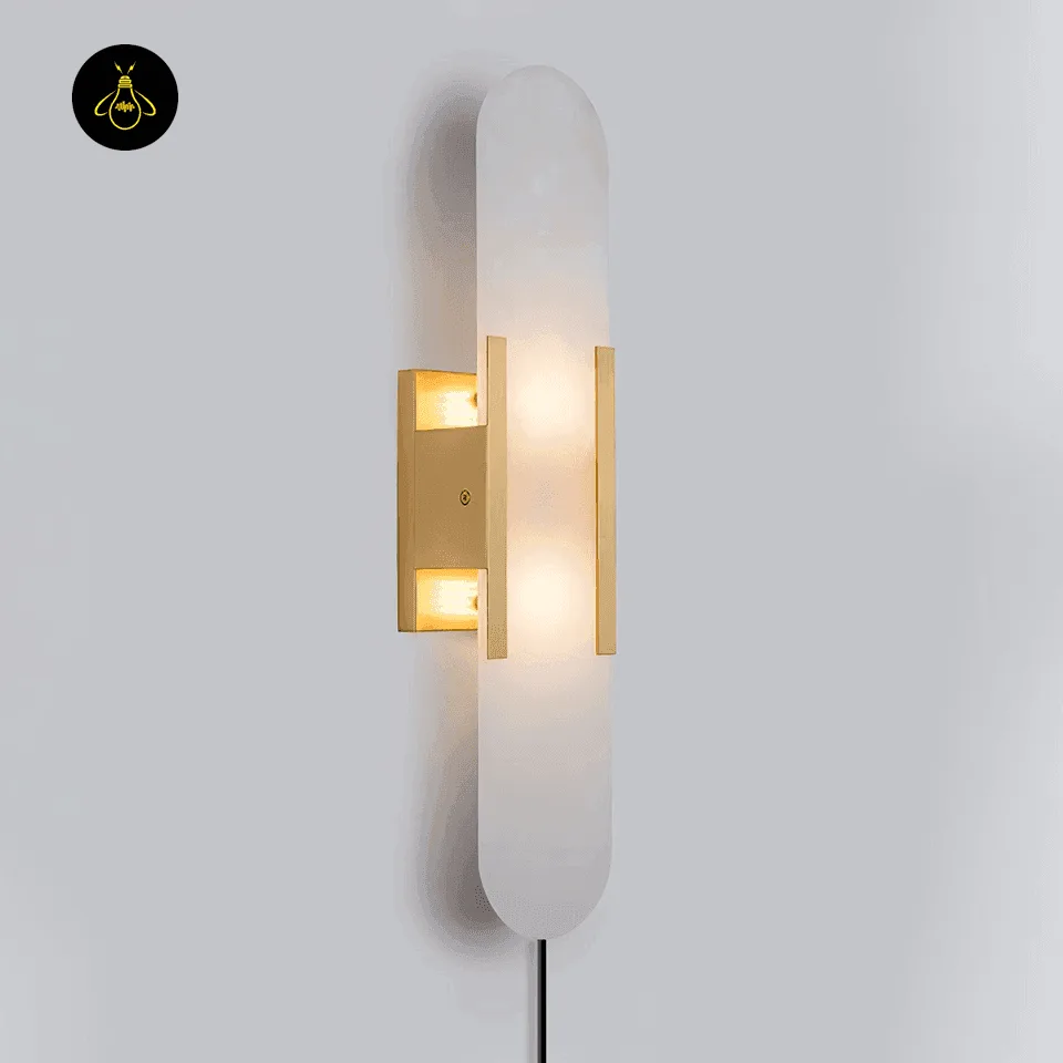 Linear Alabaster Wall Light – 50 cm Natural Stone Sconce 13 Linear alabaster wall light lit, gold-finish frame, front view on a grey wall