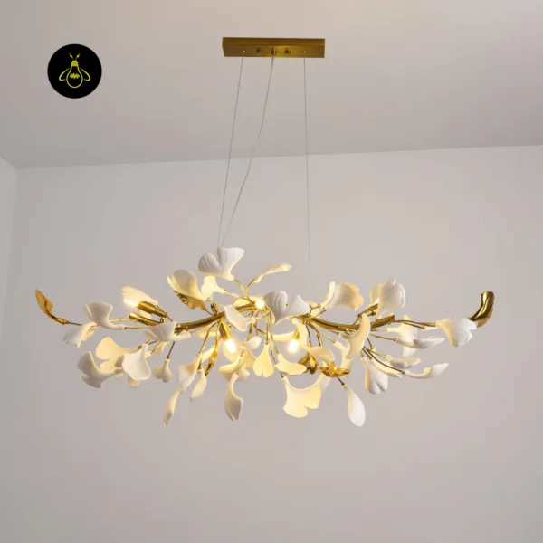 Luxury ceramic leaf chandelier glowing with warm light in a living room
