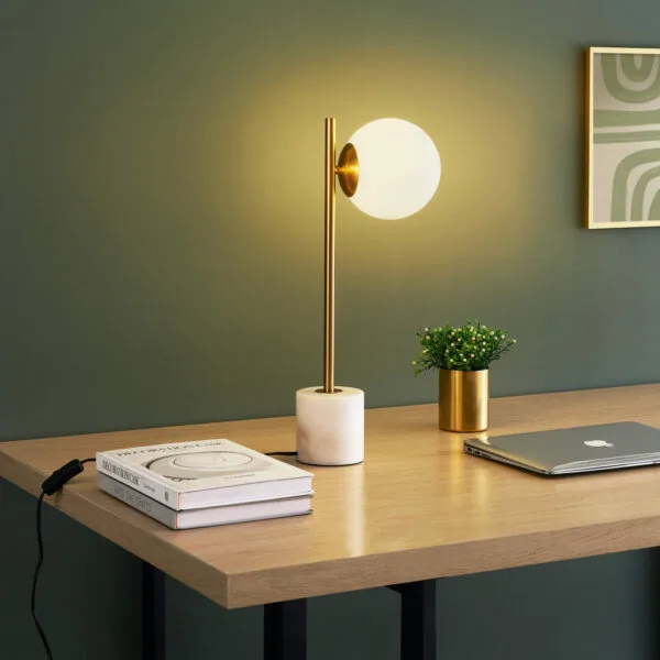 Marble table lamp with opal borosilicate glass globe in a modern decor setting