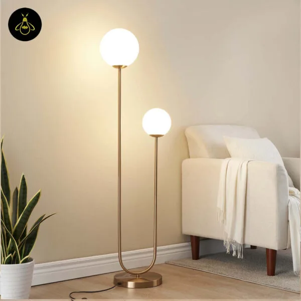 Minimalist brass floor lamp with two white opal globes