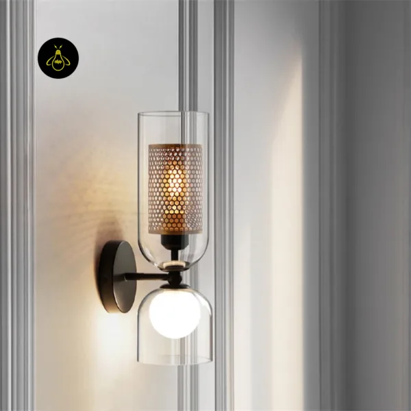 Double wall light glowing on a white panelled wall, honeycomb pattern of light on the wall