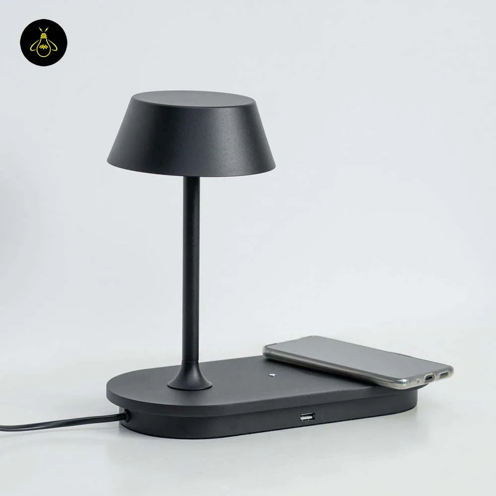 LED Table Lamp with Wireless Charging Pad – Matte Black 5 Modern matte black LED table lamp charging a phone on its wireless pad