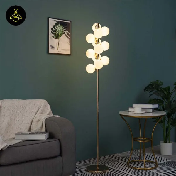 White globe floor lamp styled in a living room casting a warm ambient glow