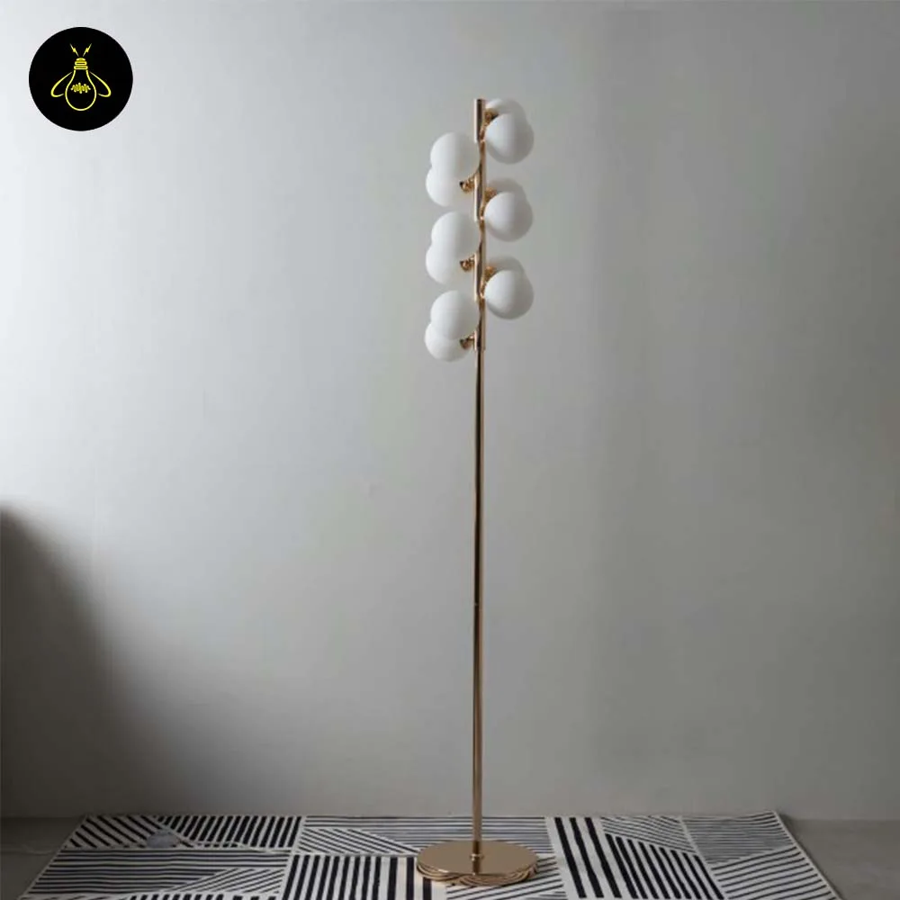 White Globe Floor Lamp – 12 Gold-Framed Opal Spheres | Ambrosia 8 White globe floor lamp unlit showing the G9 12-globe cluster on a slim gold pole and disc base