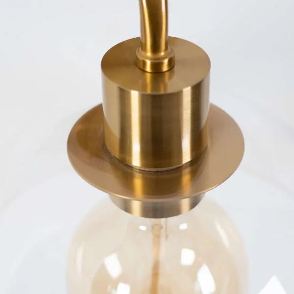 Close-up of the dome wall light holder and collar in antique brass finish on 304-grade stainless steel