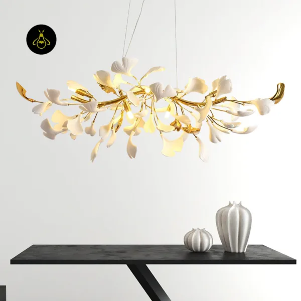 Modern sculptural gingko leaf chandelier hanging above a dining console