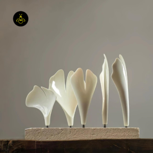 Close-up of glossy white ceramic ginkgo leaves on the ceramic ginkgo leaf chandelier