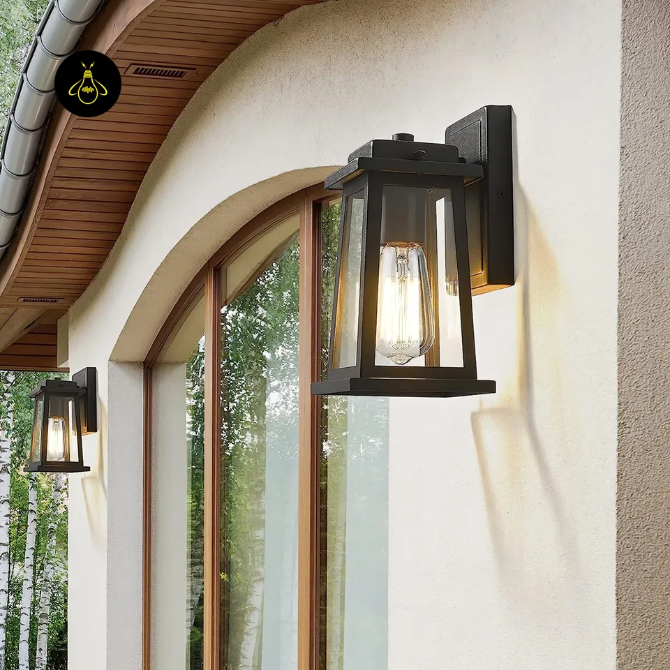 Outdoor Wall Lantern – 28 cm Black Metal & Clear Glass | Jagmag Lights 7 Classic black outdoor wall lantern on veranda wall with warm ambient glow – Jagmag Lights