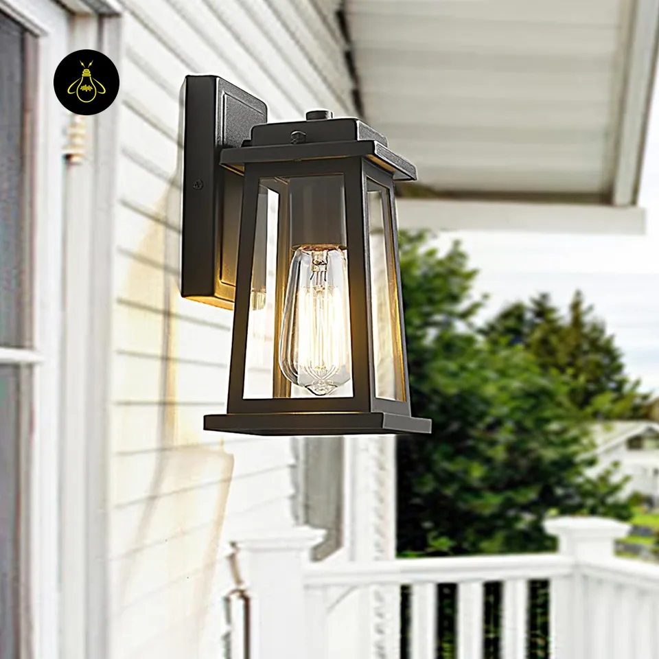 Outdoor Wall Lantern – 28 cm Black Metal & Clear Glass | Jagmag Lights 8 Black metal wall lantern on exterior facade with clear glass and filament bulb glow – Jagmag Lights