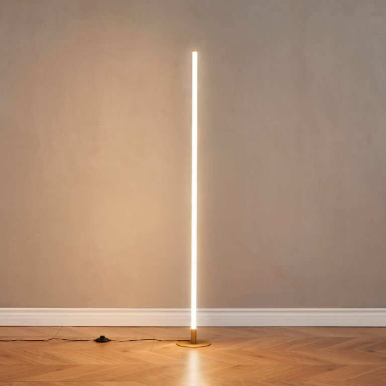Slim gold LED floor lamp shown unlit in a minimalist interior