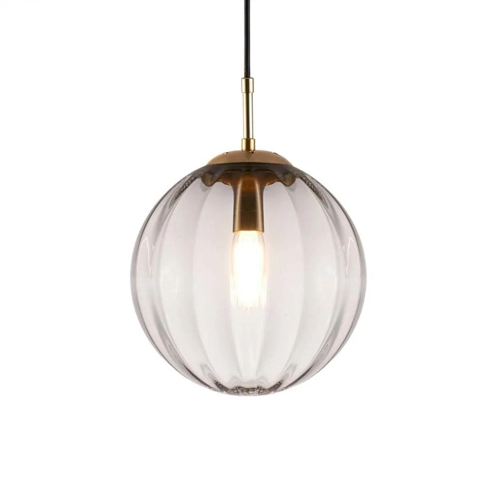 Ribbed glass ball pendant light in light smoked borosilicate glass with brushed gold fittings, front view on white