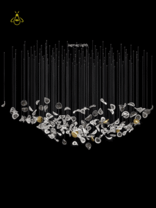 Modern glass jhumar with adjustable cable suspension and ceiling canopy for a foyer